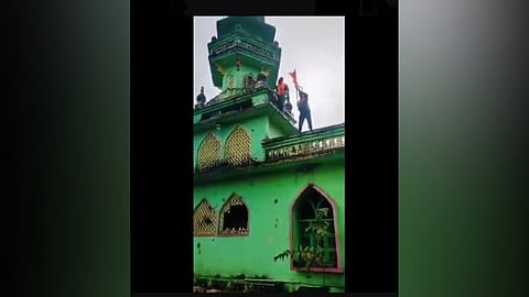 A screengrab from the viral video showing people attempting to vandalise a mosque