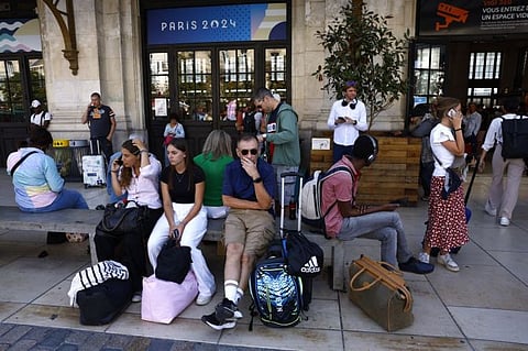 Passengers outside Gare de Bordeaux Saint-Jean station after threats against France's high-speed TGV network, ahead of the Paris 2024 Olympics opening ceremony.