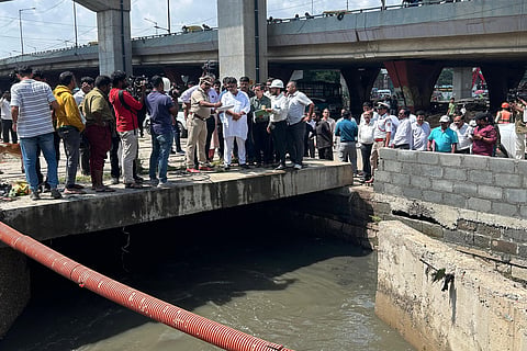 Deputy CM DK Shivakumar inspects a stormwater drain on Monday