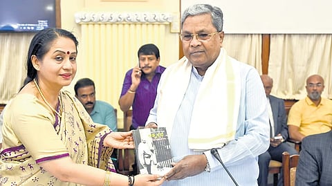 Chief Secretary Dr Shalini Rajneesh greets Chief Minister Siddaramaiah during a meeting at Vidhana Soudha