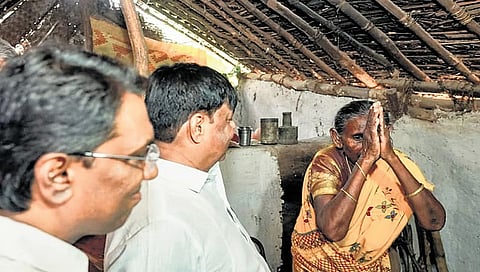 A tribal woman thanks Social Welfare Minister HC Mahadevappa for power supply