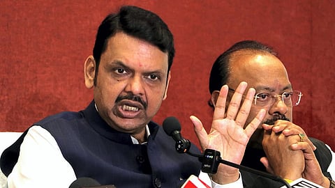 Maharashtra Chief Minister Devendra Fadnavis with Revenue Minister Chandrashekhar Bawankule addresses a press conference regarding recent voilence, in Nagpur, Saturay, March 22, 2025. PTI