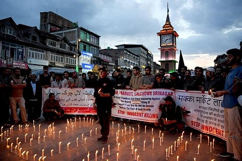 Kashmiri traders hold a candlelight vigil to condemn the Pahalgam attack, in Srinagar