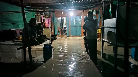 Residents in a flooded house