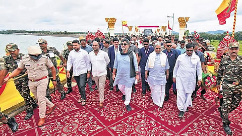 CM Siddaramaiah and DCM DK Shivakumar arrive to offer bagina at the Kabini reservoir in HD Kote taluk, Mysuru district, on Sunday.