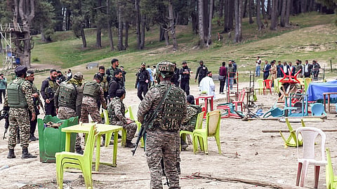Security personnel inspect the Baisaran Valley site in Pahalgam