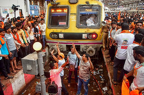 Maratha community members stop a train during their protest seeking reservation for the community under the OBC category,