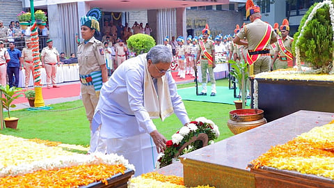 Karnataka Chief Minister Siddaramaiah places a wreath on a memorial to mark National Forest Martyrs Day in Bengaluru on Thursday.