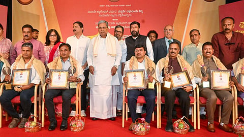 columnist Girish Linganna and TNIE's noushad conferred with development journalism award