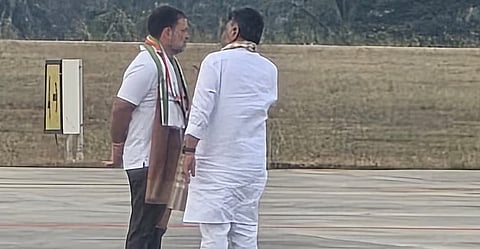 Deputy Chief Minister D K Shivakumar having a word with Congress leader Rahul Gandhi at the Mysuru airport on Tuesday