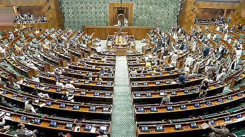 Opposition MPs protest in the Lok Sabha during the Budget session of Parliament, in New Delhi, Thursday, Feb. 5, 2026.