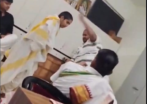 Teacher beating student