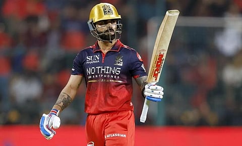 Virat Kohli celebrates his half-century