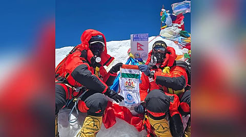 Santhosh Devarajappa and Chinmayee Thrishulamurthy pose for a picture at the top of Mount Everest.