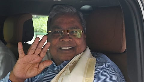 Outgoing Karnataka CM Siddaramaiah leaves from the residence of Congress national president Mallikarjun Kharge, in New Delhi on Friday.
