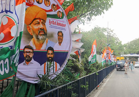 Congress Party flags and banners put up near Lok Bhavan on Tuesday, ahead of the CM swearing-in ceremomy.