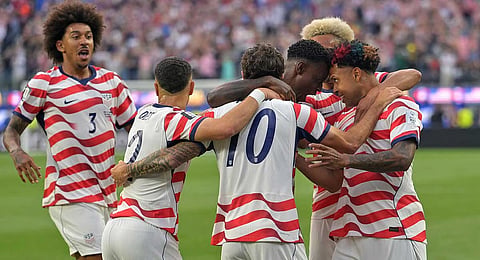 United States celebrates after an own goal by Paraguay's Damian Bobadilla during the World Cup Group D soccer match in Inglewood, Calif., near Los Angeles
