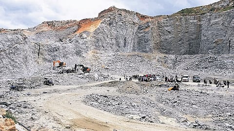 Police and emergency personnel at the stone quarry in Huluvenahalli village