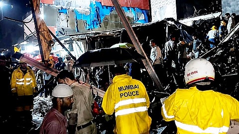 Rescue personnel conduct rescue operation after a ground-plus-three-storey chawl partially collapsed in Mumbai's Mankhurd in Mumbai, Sunday, July 5, 2026.