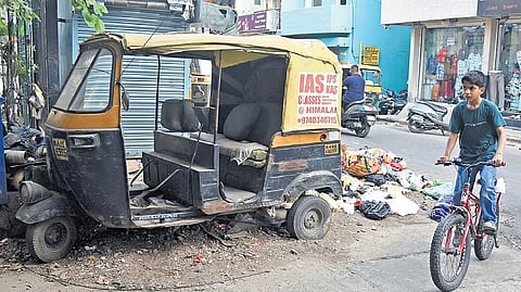 An abandoned autorickshaw on Thimmaiah Road in Bengaluru.
