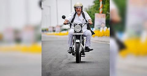 Karnataka Chief Minister D K Shivakumar rides his Yezdi Roadking motorcycle.