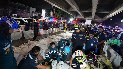 Bodies of victims of a fire are seen laid in a row in Bangkok, Thailand.