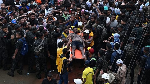 An injured devotee being carried on a stretcher