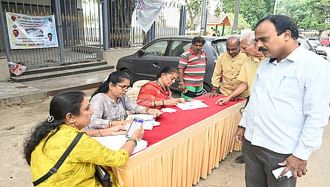 Voter ID verification at at a voter facilitation center in the Basavanagudi