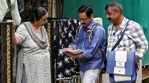 Booth Level Officers (BLOs) conduct a door-to-door Special Intensive Revision (SIR) of electoral rolls and a voter enumeration drive in New Delhi.