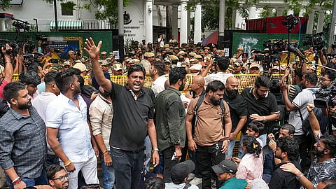 Cockroach Janta Party (CJP) supporters stage a protest outside Parliament Street police station