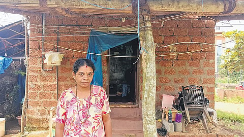 Geeta who is waiting for title deed outside her unplastered house