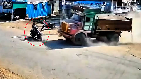 Girl Grabs Dumpers Bumper to Escape Being Crushed