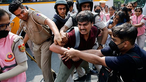 Security personnel detain protesters during a protest by the Cockroach Janta Party in New Delhi, October 10, 2026. Pic: Adnan Abidi/Reuters