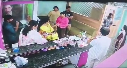 Six people held for threatening spa owner