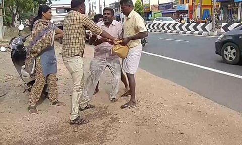 தீக்குளிக்க முயன்ற விவசாயி.
