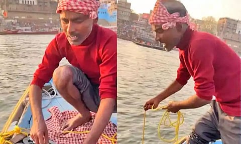 கங்கை நதியில் காந்தத்தை வீசி நாணயங்களை அள்ளும் வாலிபர்