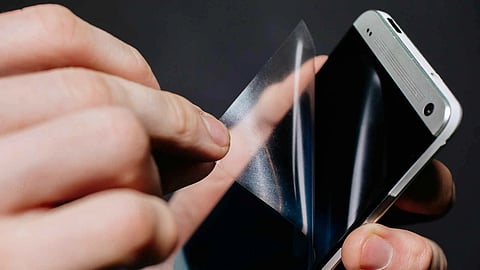 Screen guard being removed from a amrtphone