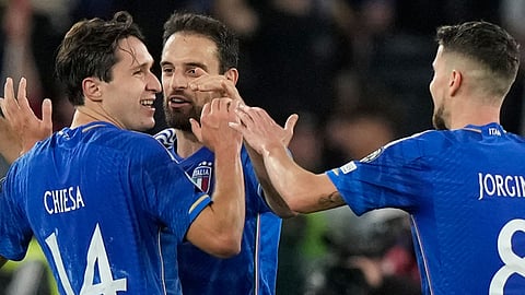 Italian players celebrate Euro 2024 qualification.