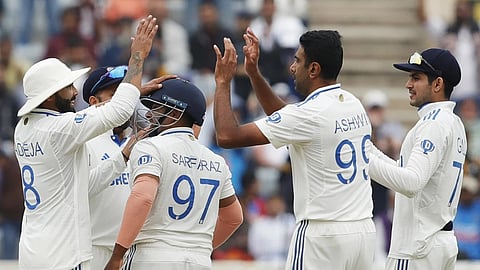 R Ashwin celebrates an England wicket with his team mates.