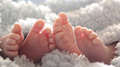 Blamed for son's disability; Mother kills twins and commits suicide