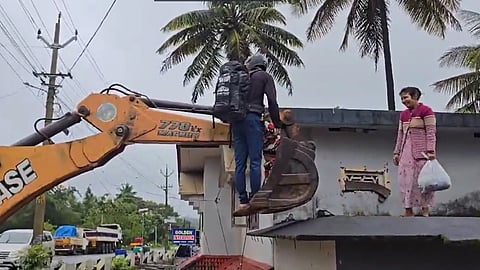 heavy rain family rescued with excavator