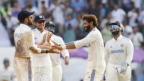 Ravindra Jadeja celebrates a New Zealand wicket with his team mates