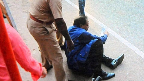 TP Sreenivasan being attacked by left student orgnaizations over recommendations on educational policy