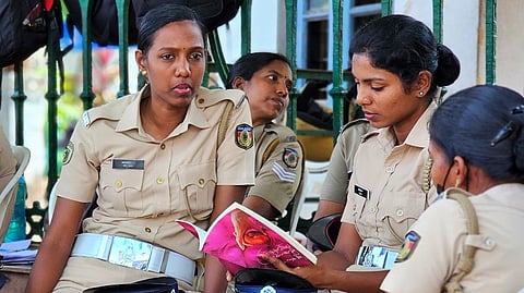 A police officer reads KR Meera's novel during duty break