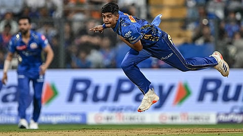 Mumba Indians debut left arm pacer Ashwani Kumar bowls