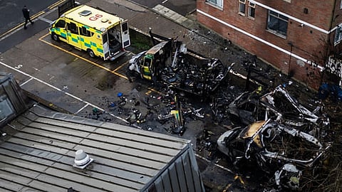 An aerial view of firefighters continuing to monitor the scene after four Hatzola ambulances burned overnight near the Maksaik Hadath Synagogue in the Golders Green area of London, England, on March 23, 2026.