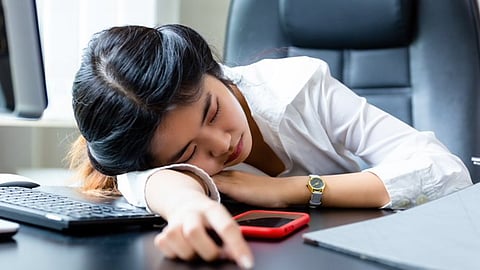 Woman takes five hours sleep at office to protest low salary