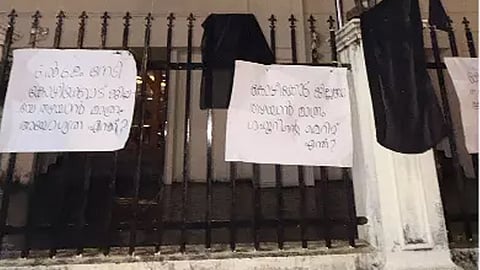 black flag and poster infront of league house kozhikode