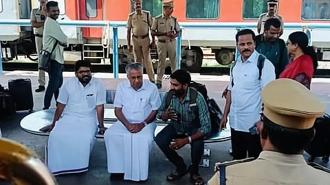 Pinarayi sitting on a bare steel bench, no crowd or security; Photo goes viral