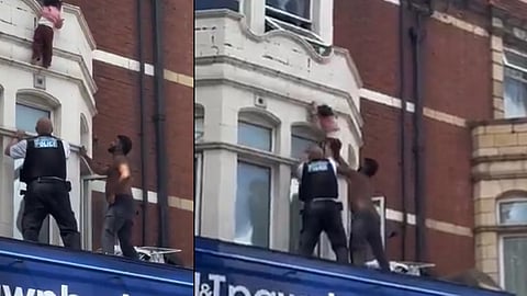 Baby hangs from building; Malayali rescues him
